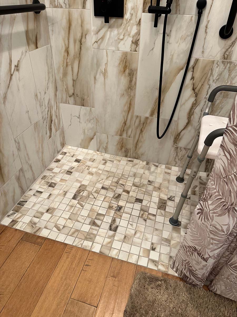 Glass and tile shower after bathroom remodel